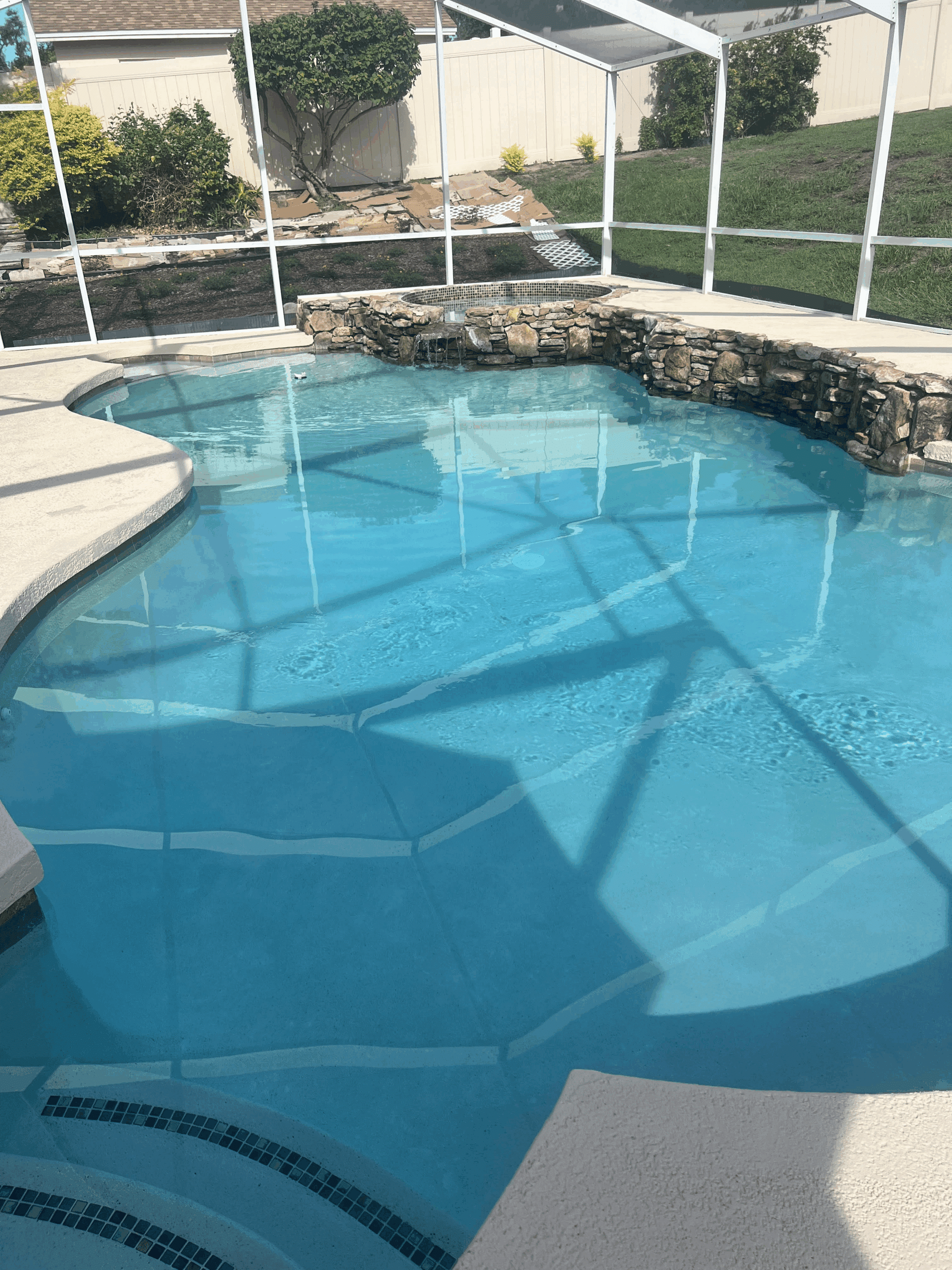 Swimming Pool With Landscape Grass And Plants Around
